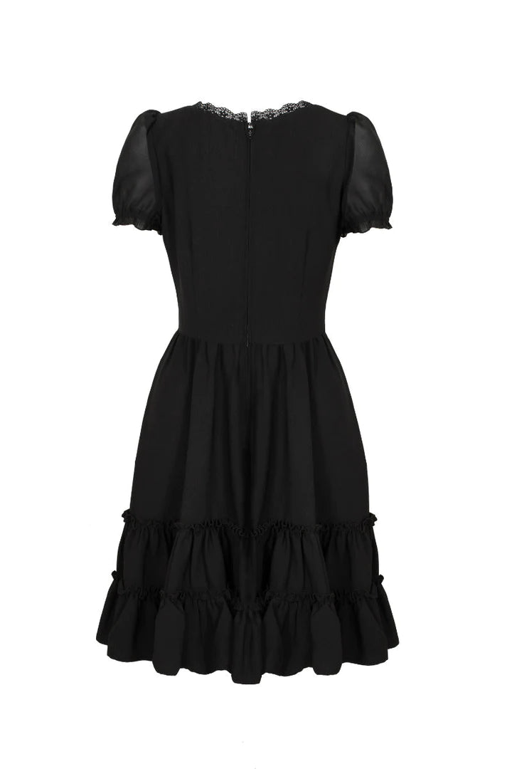 Rear view of the black dress with lace neckline against a white background