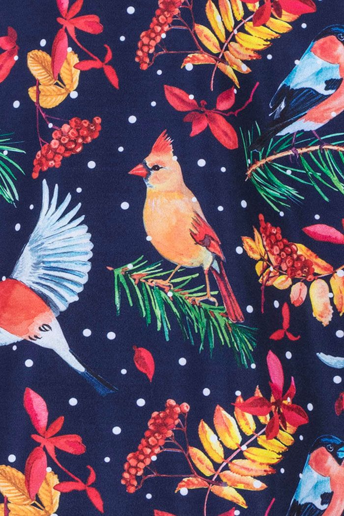 Close up of the Christmas print Lyra dress by Lady Vintage featuring song birds, winter leaves and berries and snow.