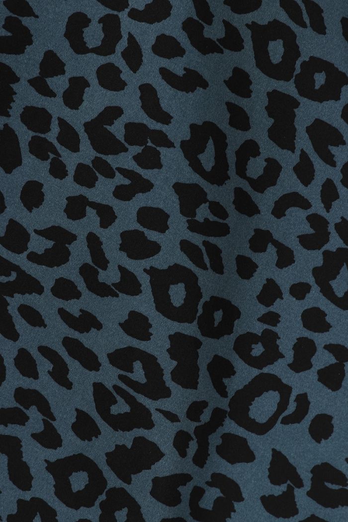 Close up of the black leopard print on the navy blue background