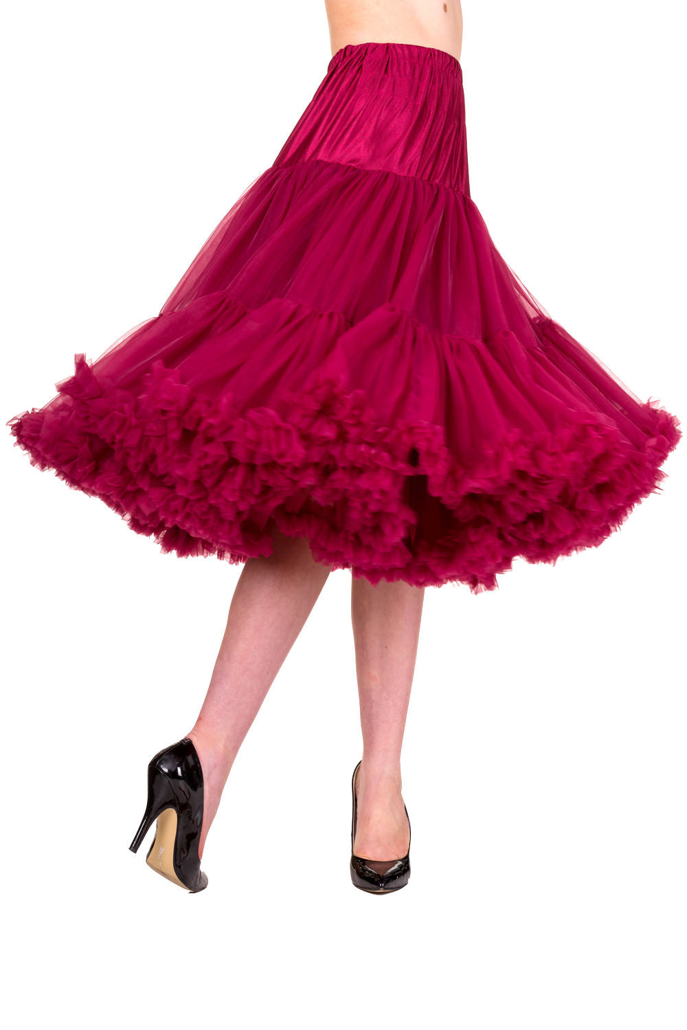 Model wearing a burgundy petticoat mid-twirl 