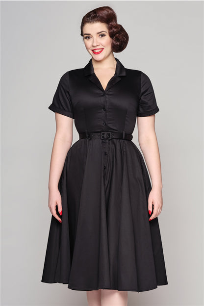 Glamorous woman wearing red lipstick, a vintage up-do and the plain black Caterina dress by Collectif with shirt style collar and button front