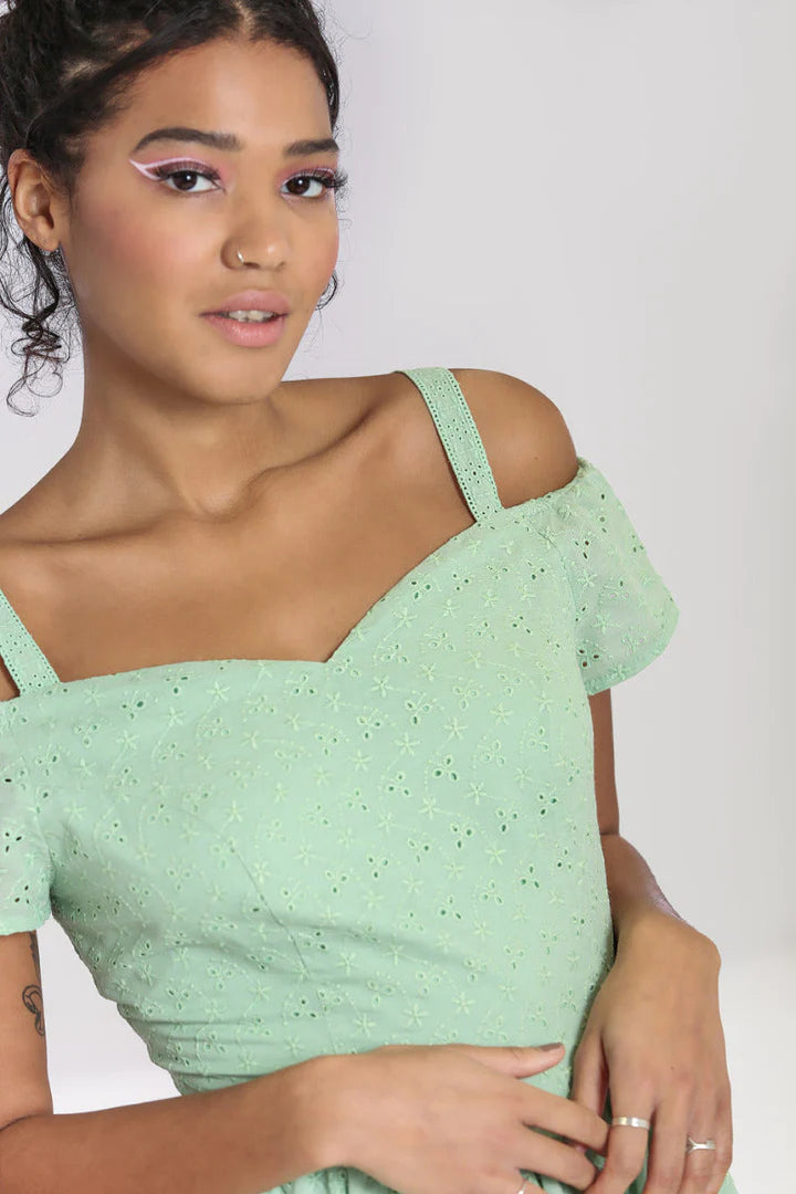 Close up of elegant young woman wearing the Celia Mint Green 50s dress