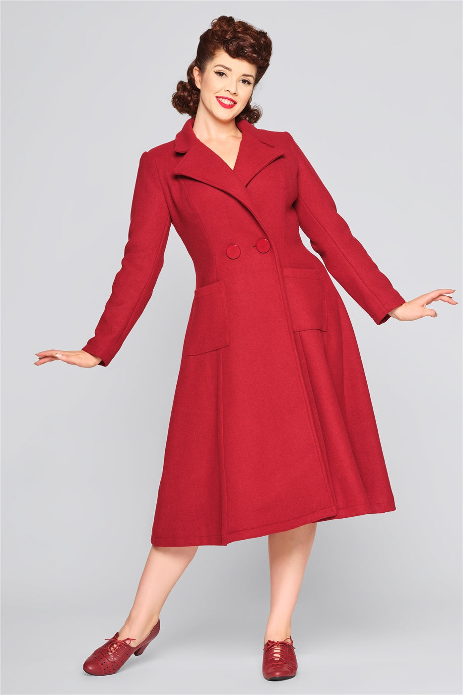 Classic vintage model wearing a long burgundy women's coat 