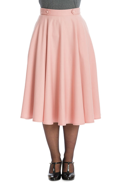 Di Di Pink swing skirt worn with sheer tights, a grey blouse and black T Bar heels