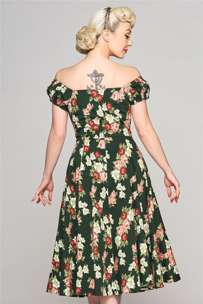 Elegant woman with her blonde hair in an up-do and an anchor tattoo on her back wearing the Dolores Vintage Bloom Doll Dress facing away from the camera with her arms by her sides 