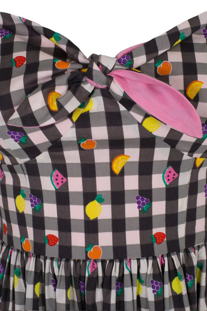 Close up of the front tie bow and mini colourful fruit pattern on the Fruitylou Mid Dress.