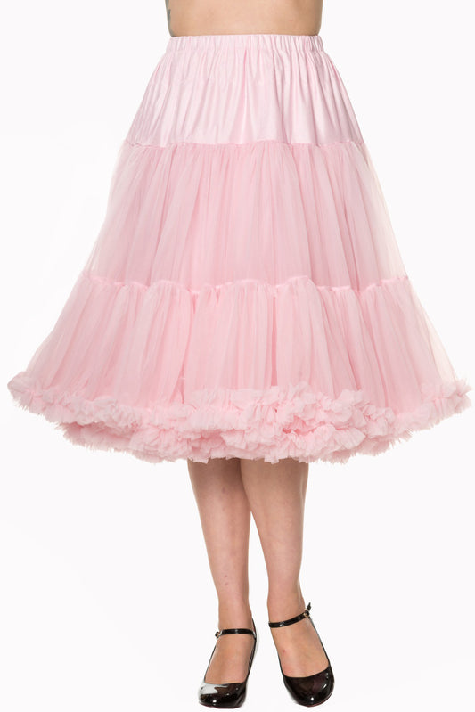 Classic light pink full 26 inch petticoat worn by slim woman wearing black strappy pumps