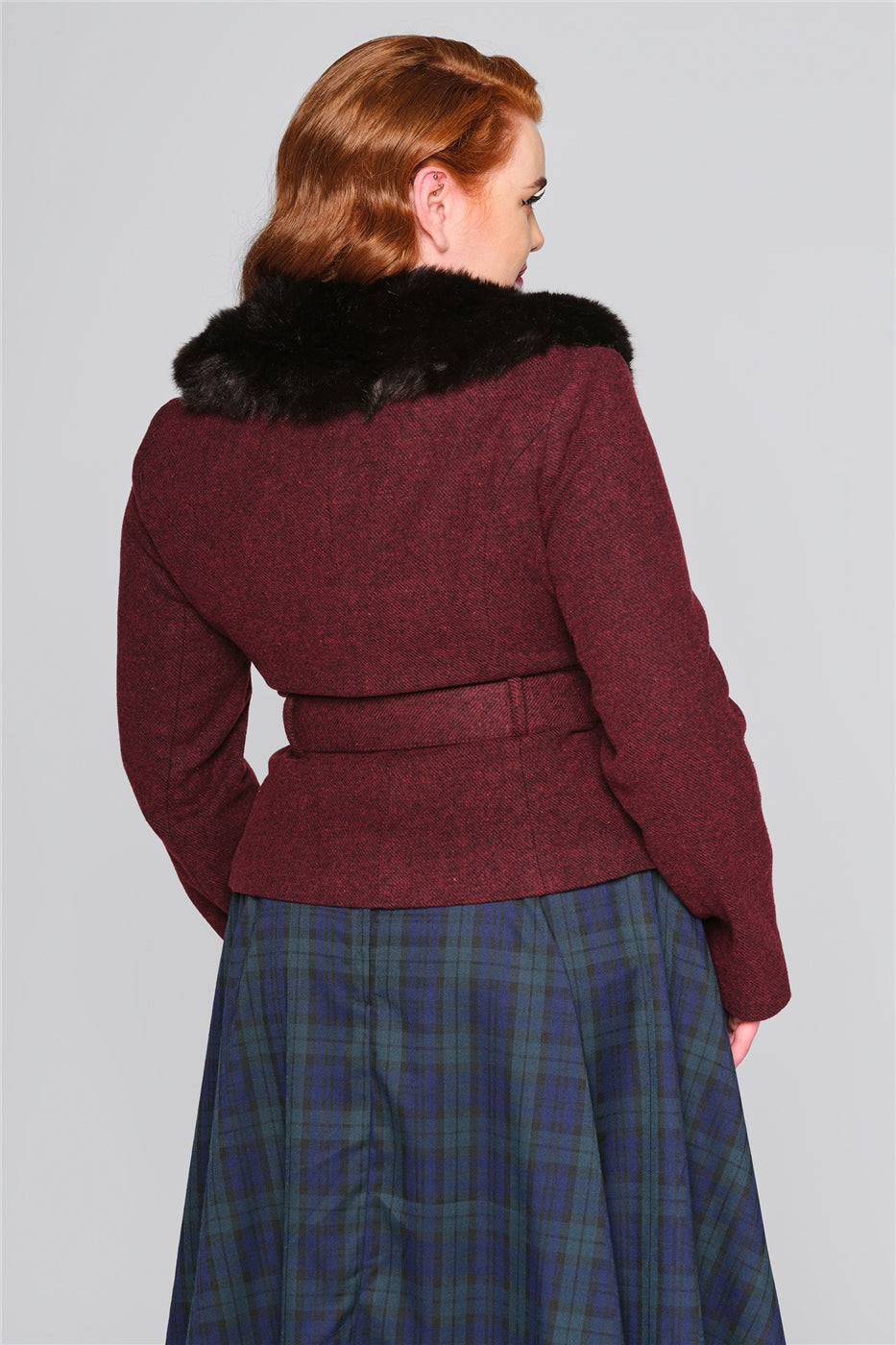 Plus size model facing away showing off the back of the Burgundy Molly Jacket by Collectif