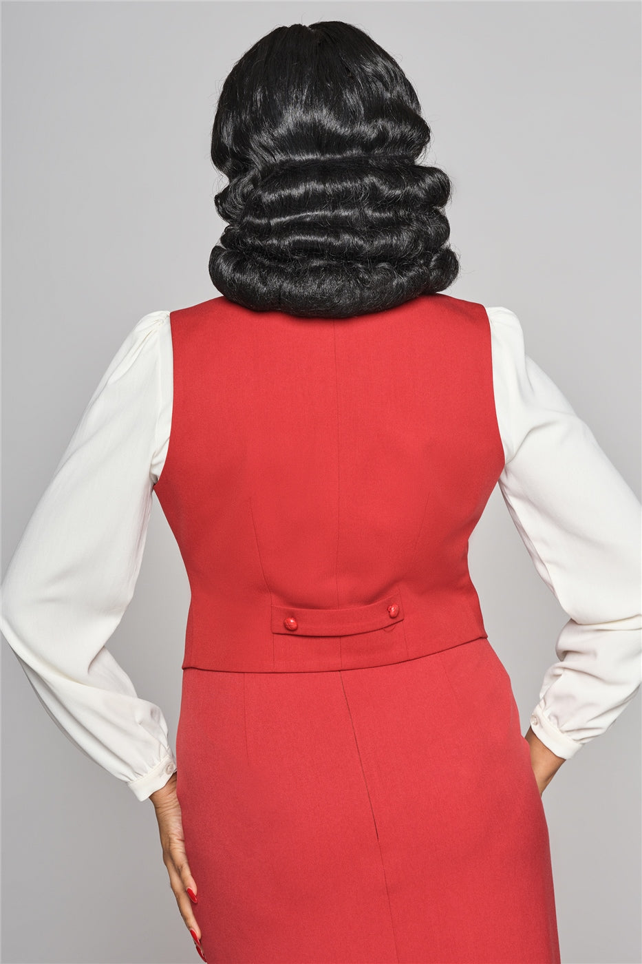 The back of the Professor waist coat by Collectif worn by a lady standing with her hands on her hips