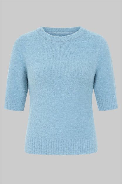 Powder blue round neck top with 3/4 length sleeves  on a plain bvackground