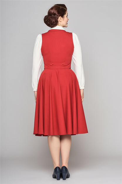 The Professor red waistcoat by Collectif worn by a slim brunette with a long sleeved white blouse and red 50s style swing skirt. 