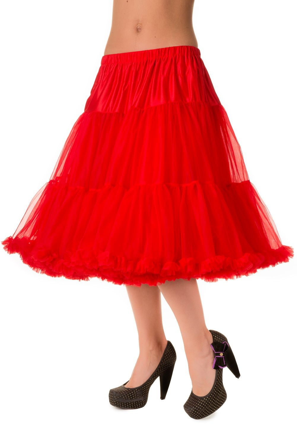 Model wearing polka dot black shoes and a ravishing red 26 inch petticoat