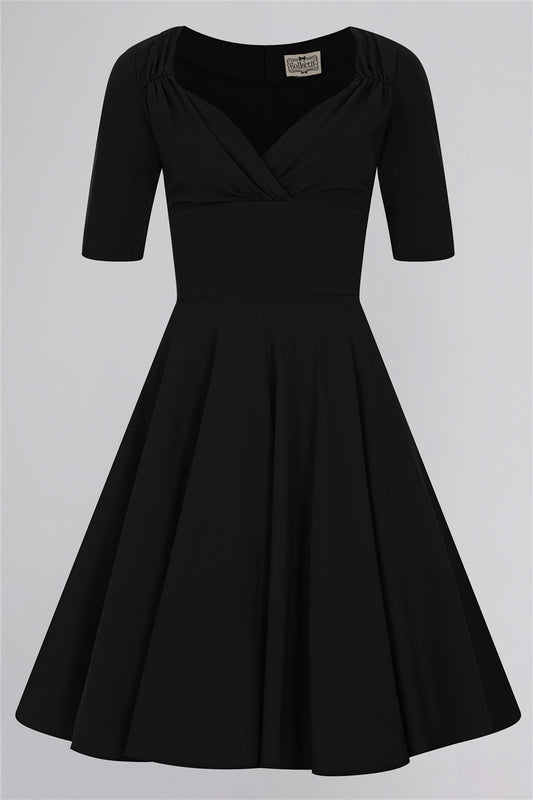 Vintage style classic 50s black dress with 3/4 length sleeves, wide waistband and flared skirt 