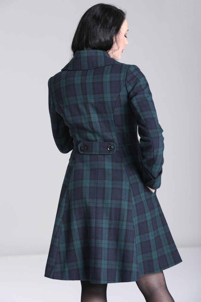 The back of the Alessandra coat by Hell Bunny being worn by a dark haired model