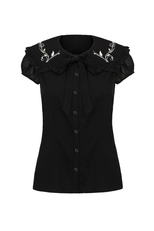 A short-sleeved black blouse with a frill collar and white embroidery, featuring a removable bow tie at the neck.