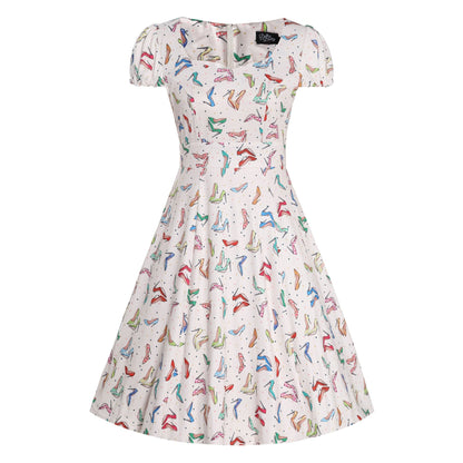 Claudia Cream Stiletto Print Swing Dress by Dolly & Dotty, featuring a fun, colorful stiletto shoe print on a cream background. This vintage-inspired dress has a square neckline, short puff sleeves, and a fitted bodice that flares into a full swing skirt, adding a playful and retro style.