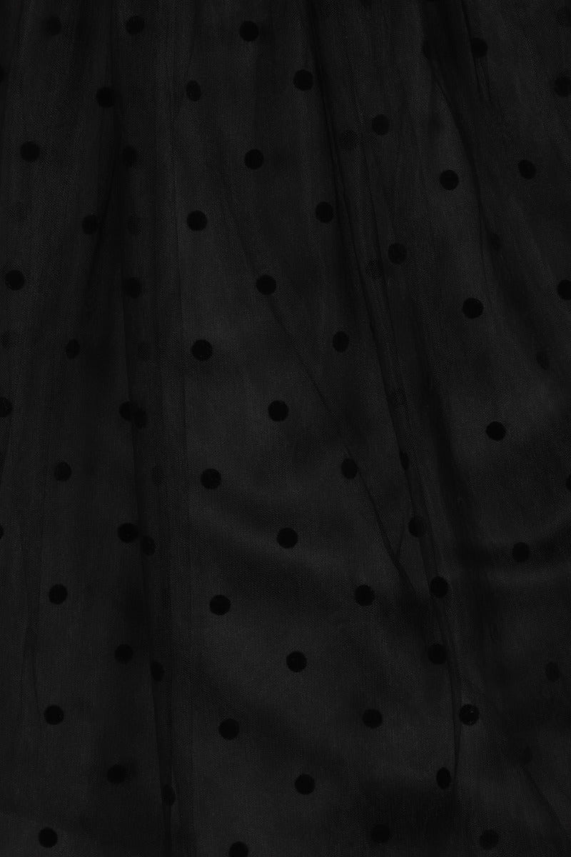 Closeup of black polka dot mesh on the Amandine skirt