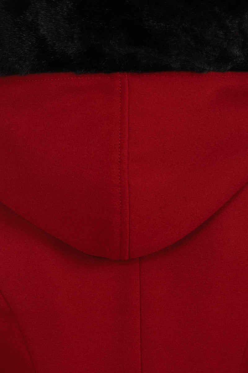 Close up showing the back of the fur trim hood on the Red Amaya Swing Coat