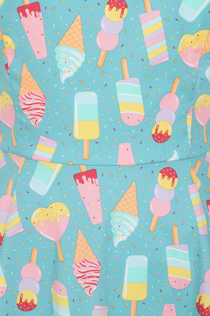 Close up of the light blue ice cream dress with multicoloured ice creams all over and sprinkles.