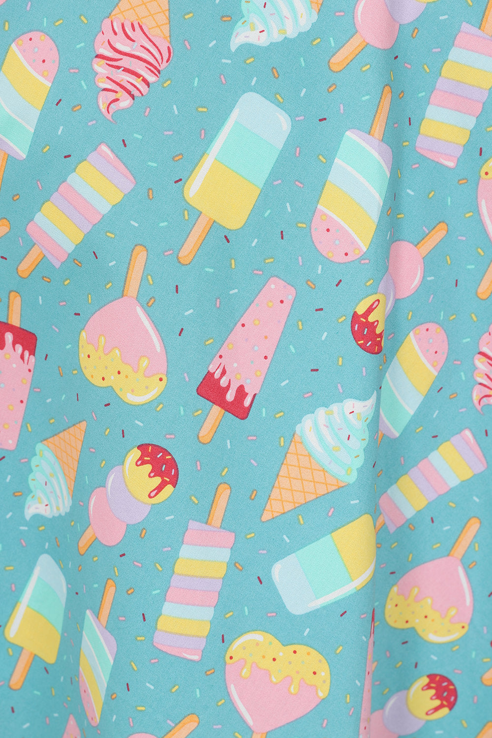 Ice cream dress fabric with multicoloured ice creams and lollies with multicoloured sprinkles.