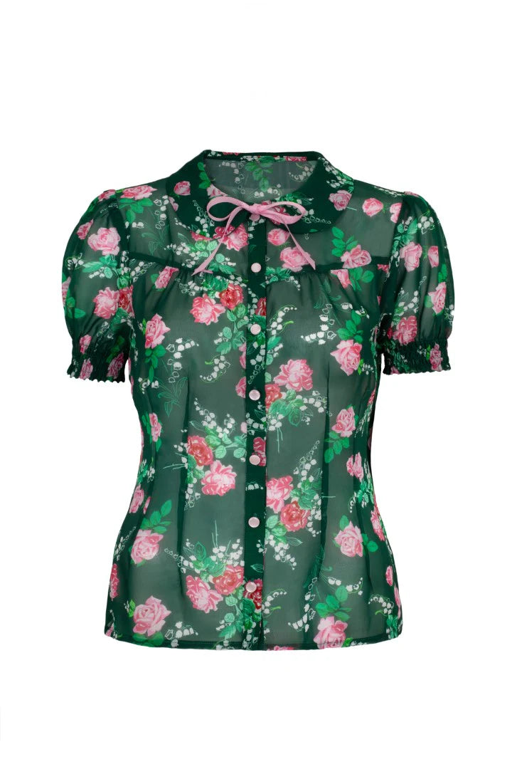 Green floral blouse with pink flowers on a white background