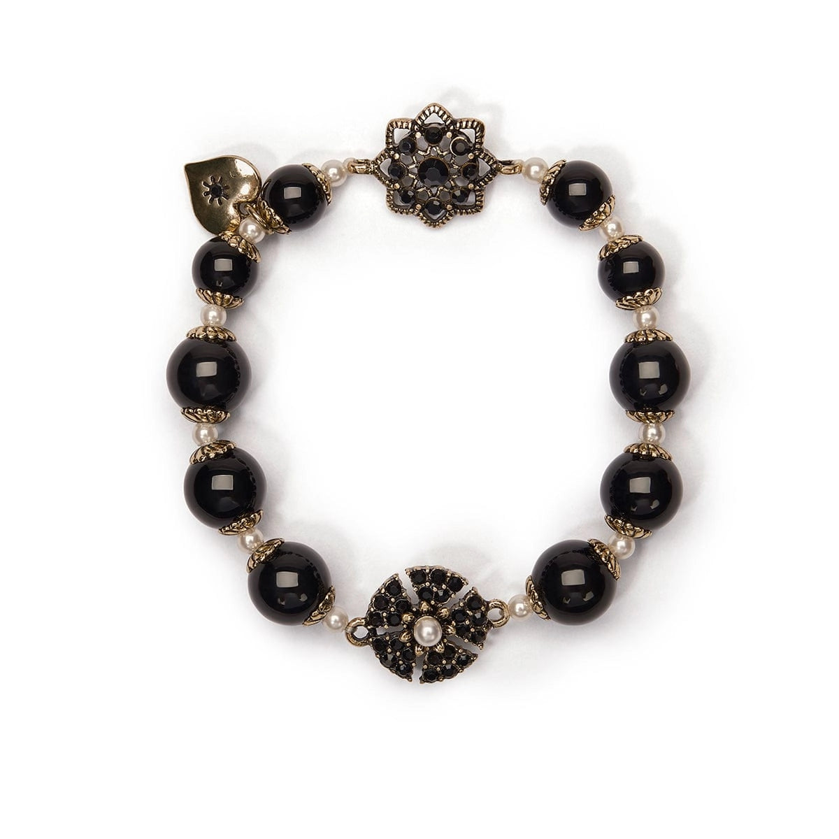 Black beaded bracelet with decorative clasp on a white background