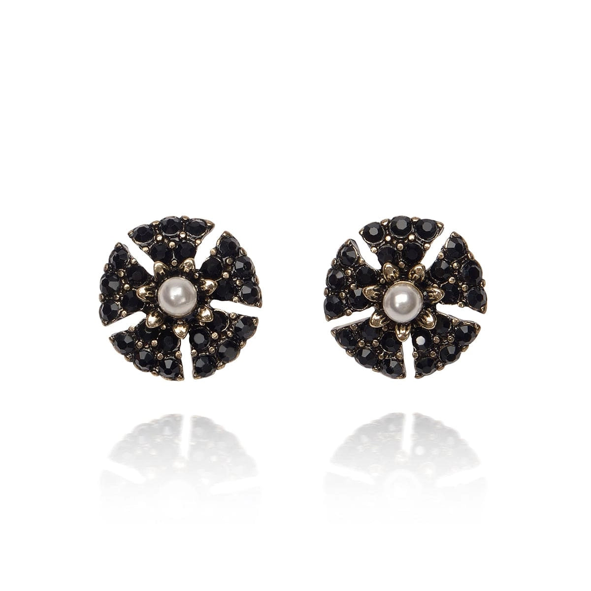Pair of earrings with black and gold design on a white background