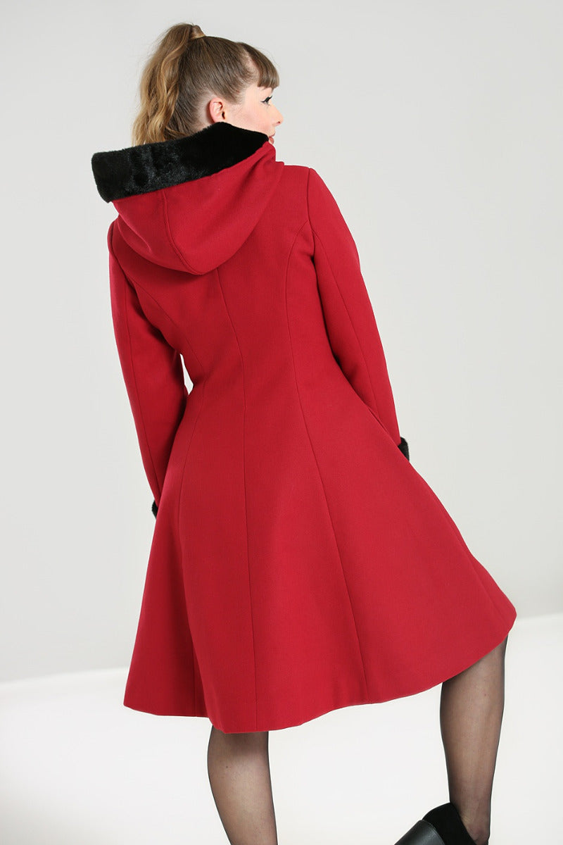 Vintage model showing off the back of the burgundy red swing coat