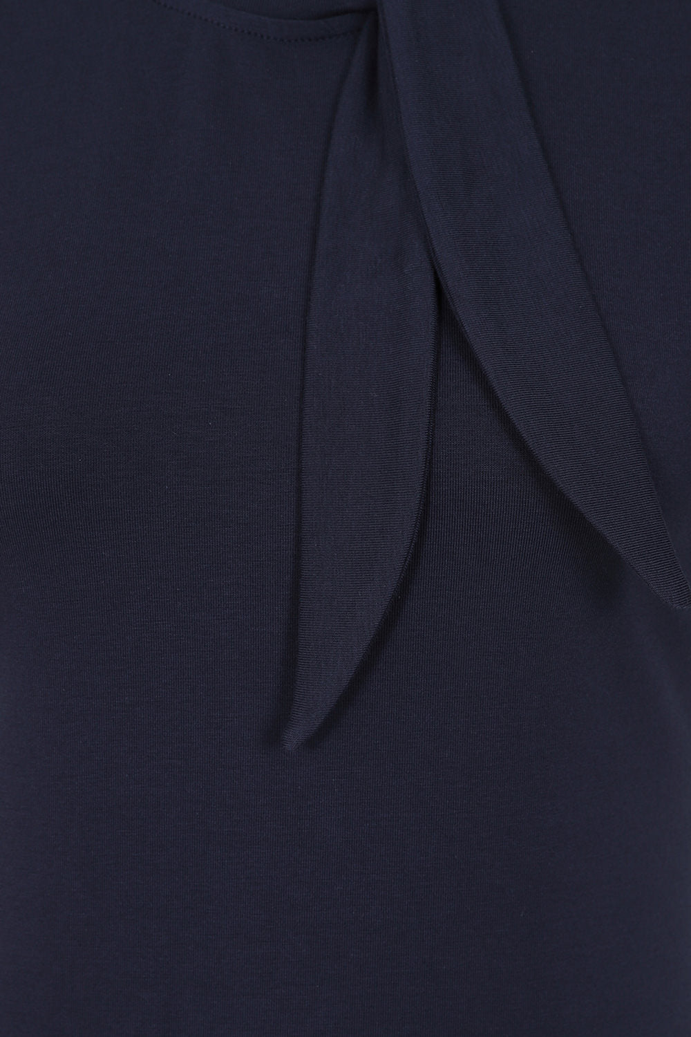 Close-up of the plain navy Sandy Loves Danny Top tie bow neck.