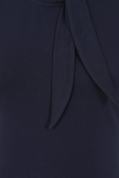 Close-up of the plain navy Sandy Loves Danny Top tie bow neck.