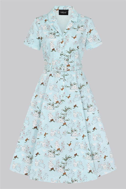 Light blue shirt dress with short sleeves and button front with a snowy rabbit print all over