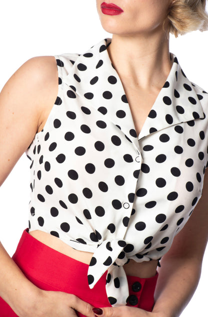 Close up picture of the polka dot tie front "Polka Love" top. The wide collar, sleeveless design and tie front make this a rockabilly masterpiece!