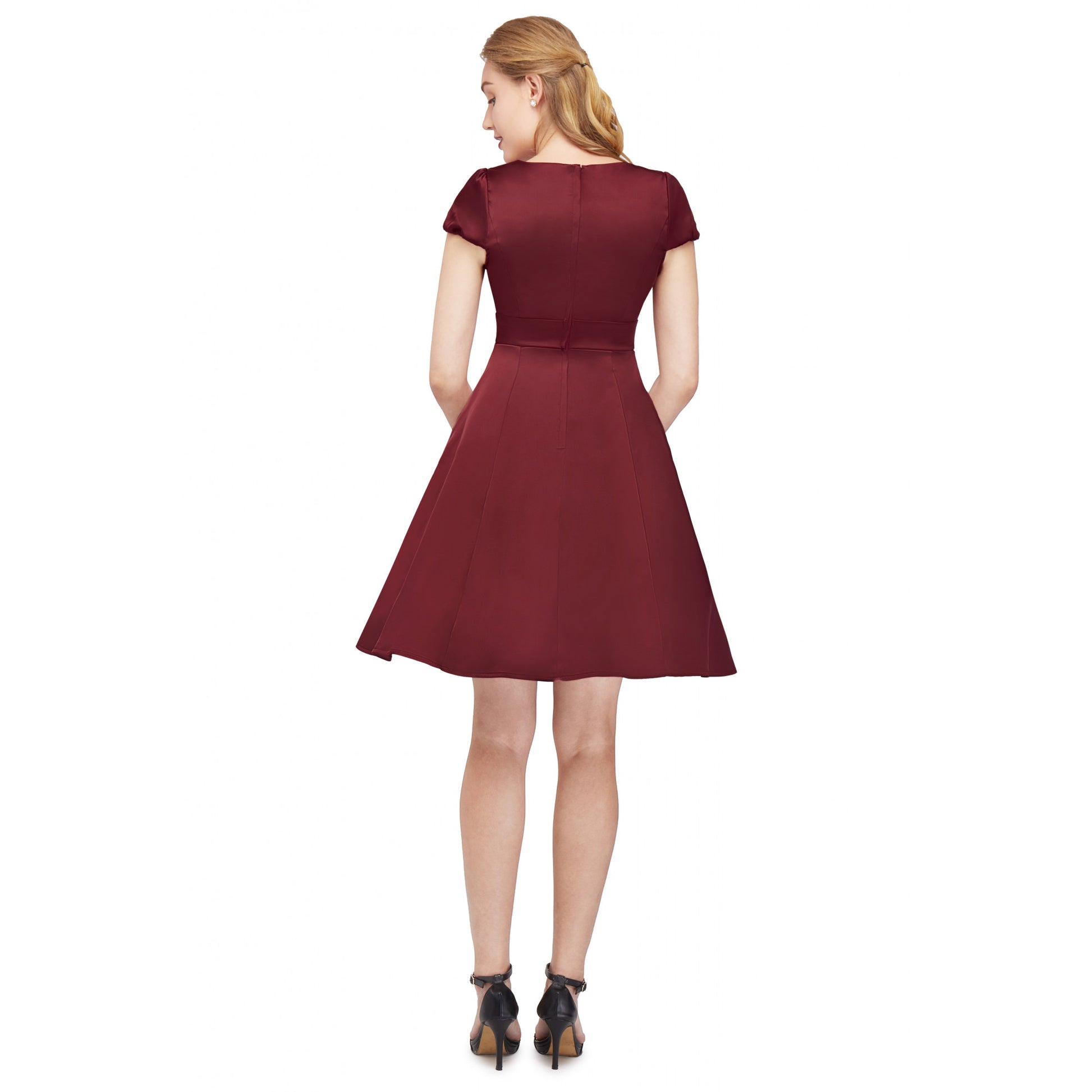 The back of the Claudia fit and flare 50s style satin dress in a deep burgundy hue.