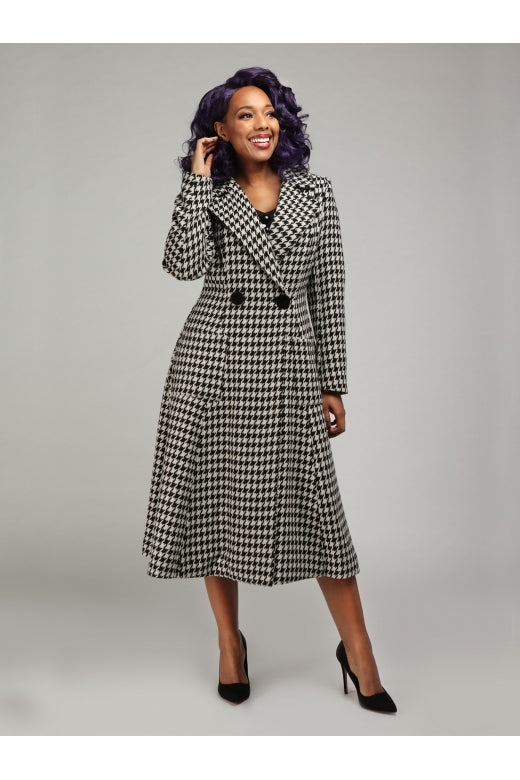 Gorgeous smiling model wearing a black and white houndstooth vintage women's coat 