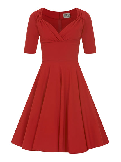 A plain red 50s style swing dress against a white background