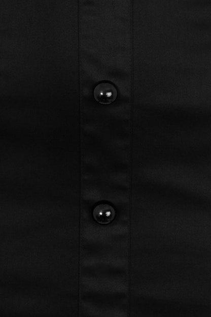 Close up look at the black round buttons at the front of the skirt