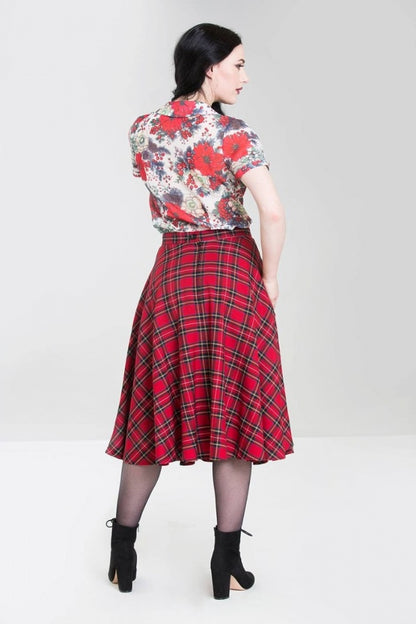 Back of the Irvine tartan skirt, worn by a model with black hair and chunky heeled boots