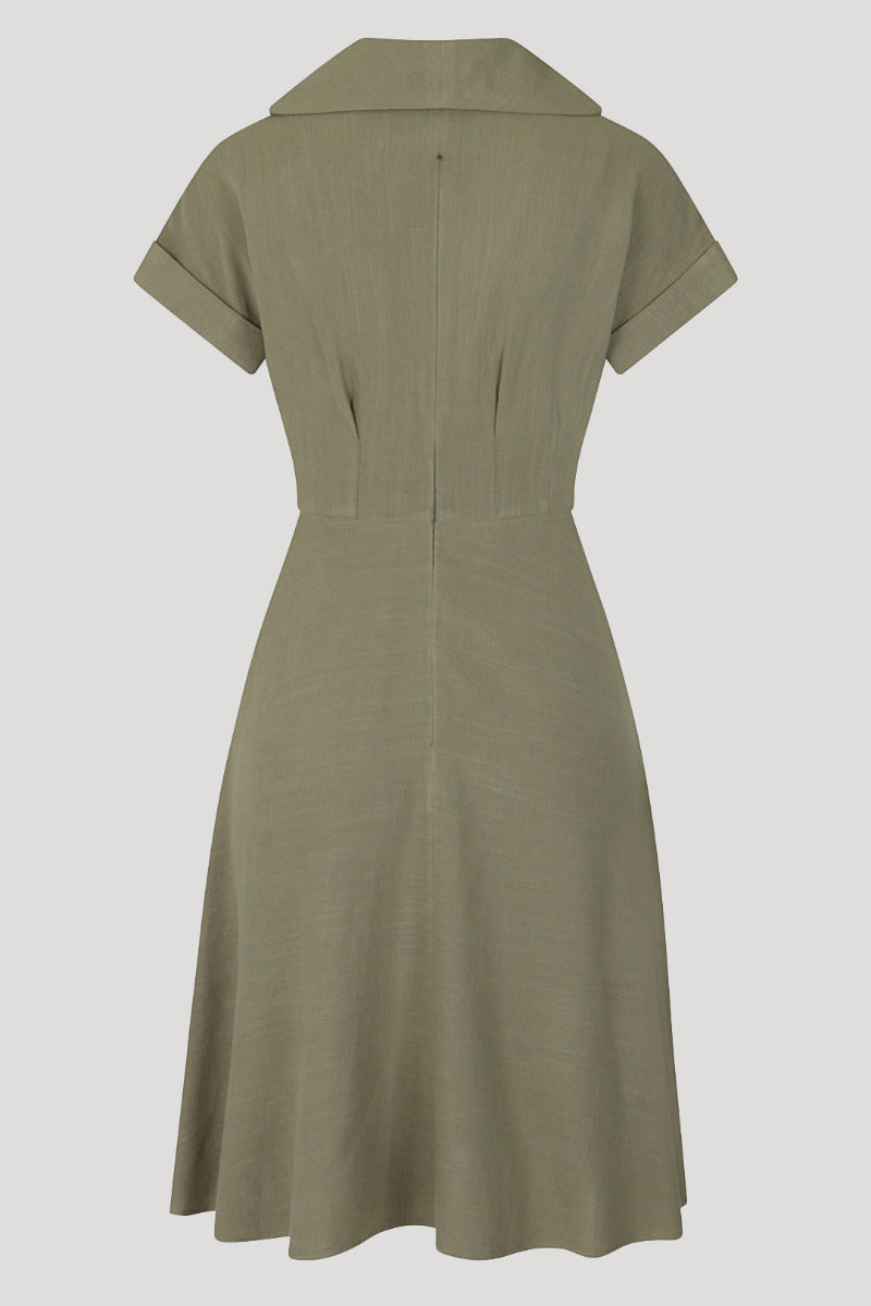 Back of a khaki green 40s style dress flat lay against a white background